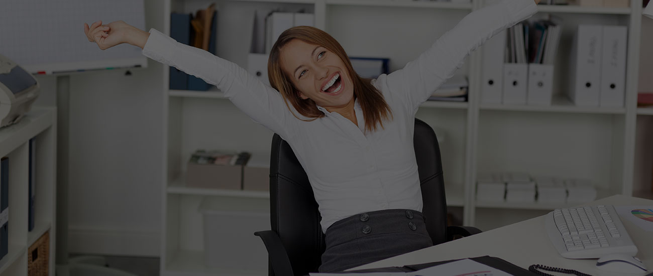 women celebrating at desk